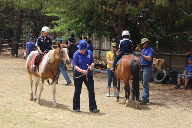Children demonstrate what they have achieved through their therapeutic riding lessons at Sarda